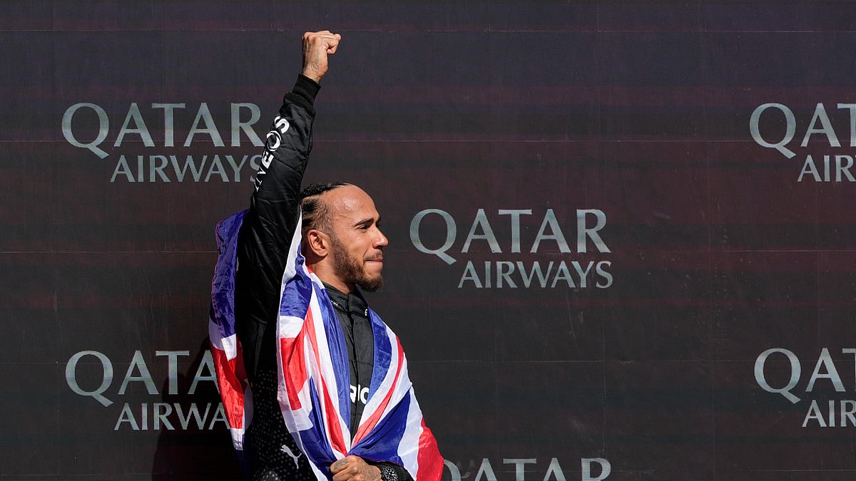  (AP Photo/Luca Bruno)
 : Mercedes driver Lewis Hamilton of Britain celebrates on the podium after winning the British Formula One Grand Prix race at the Silverstone racetrack, Silverstone, England, Sunday, July 7, 2024.

